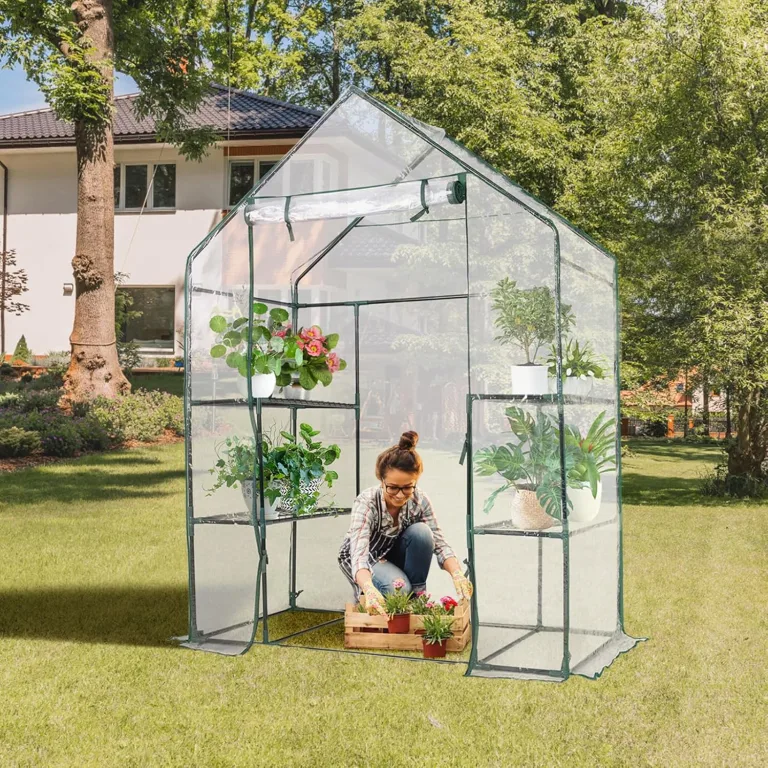 HOMASIS Gewächshaus mit 6 Ablageflächen, transparentes Foliengewächshaus aus PVC, Treibhaus mit Rolltor, Pflanzenhaus mit Metallrahmen, Blumenhaus für Winter, 143 x 73 x 195 cm, Weiß – Bild 3